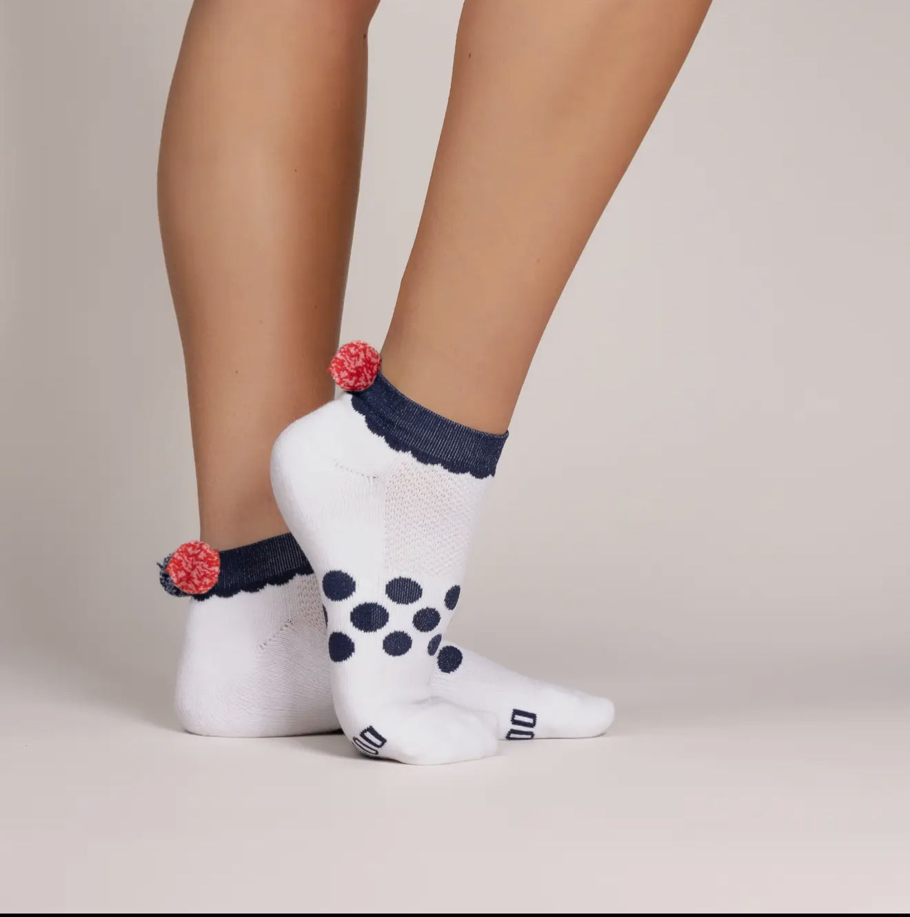 Ankle socks with navy and red trim and Pom Poms